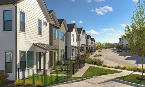 row of homes with fenced in yards
