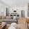 Cozy living area with cozy seating and a staircase in view