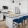 Open kitchen with designer finishes, featuring modern cabinetry and stainless steel appliances