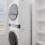 Laundry room with washers and dryers in a clean, organized space